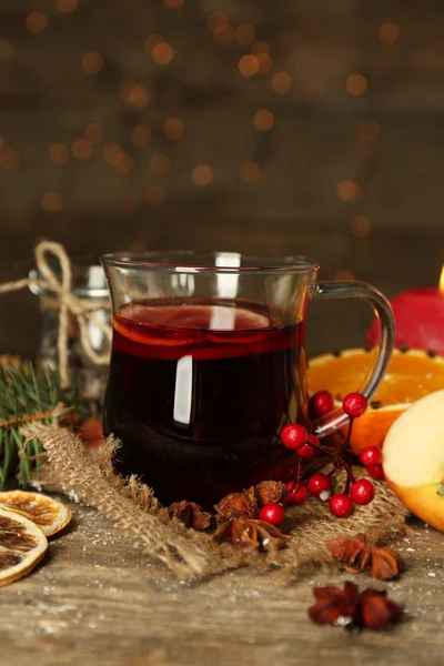 Beautiful Christmas composition of mulled wine on decorated wooden table, close up — Stock Photo, Image