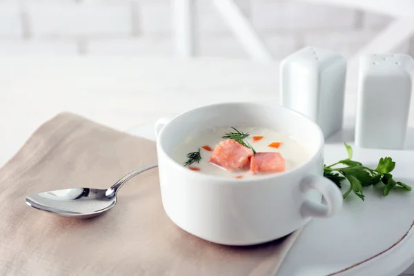 Delicious salmon cream soup on white served table in the restaurant — Stock Photo, Image