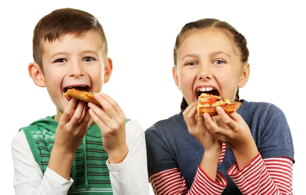 Children eating pizza isolated on white — Stock Photo, Image