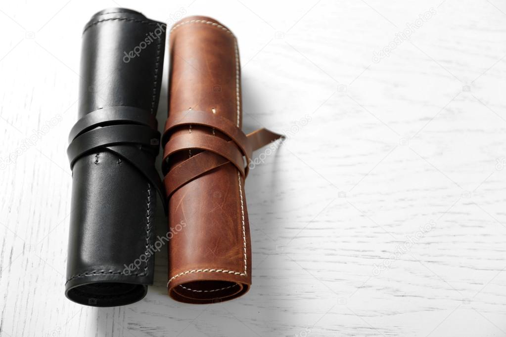 Leather cases on light wooden