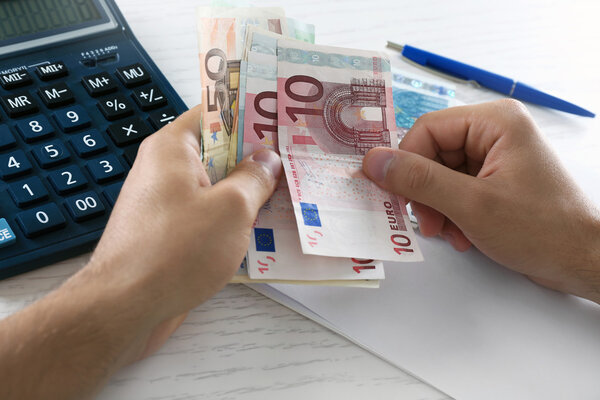 Man Calculating money