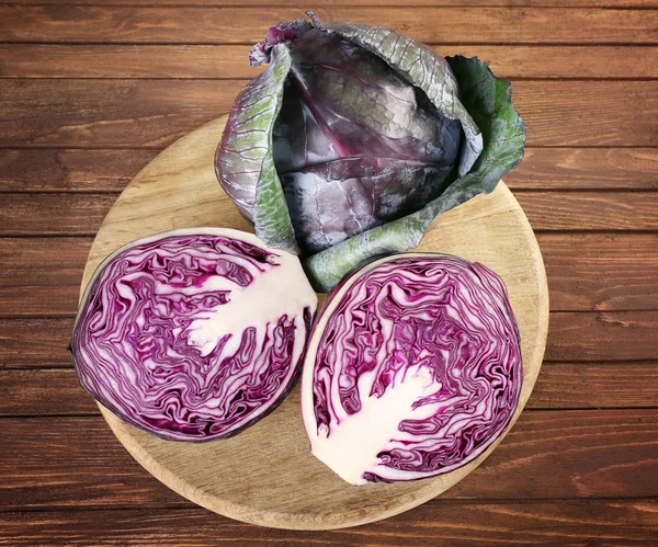 Red cabbage on wooden table — Stock Photo, Image