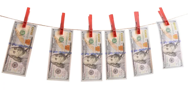 Conceito de lavagem de dinheiro - dólares estão secando no cabo isolado no fundo branco — Fotografia de Stock