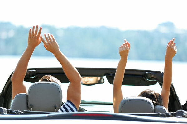Couple in cabriolet car