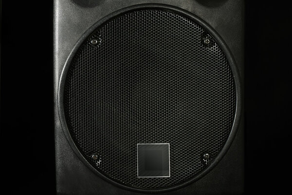 Big loudspeaker on black background