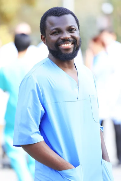 Portrait Handsome Smiling Doctor Blurred Background — Stock Photo, Image