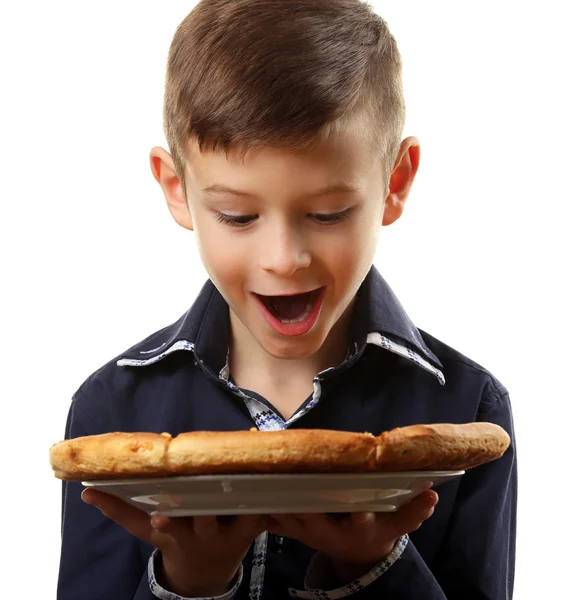 Kleine jongen bedrijf pizza — Stockfoto