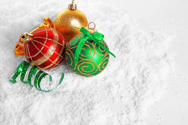 Christmas balls on snow — Stock Photo, Image