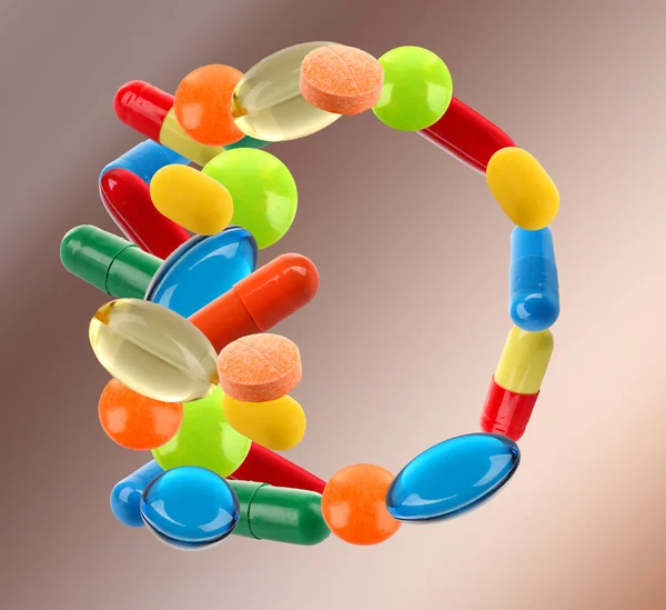 Letter D made of different pills — Stock Photo, Image