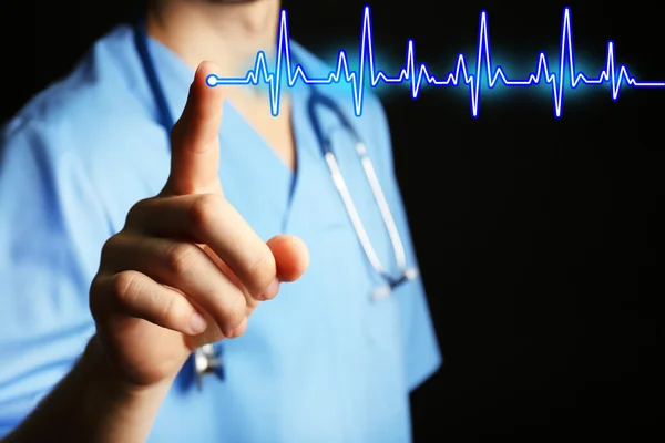 Male doctor with cardiogram — Stock Photo, Image