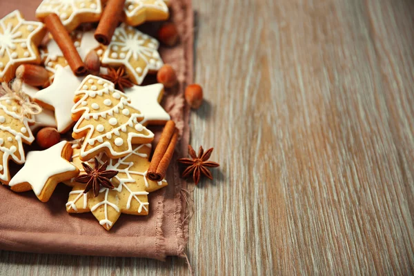 Christmas cookies with spices on wooden table — Stock Photo, Image