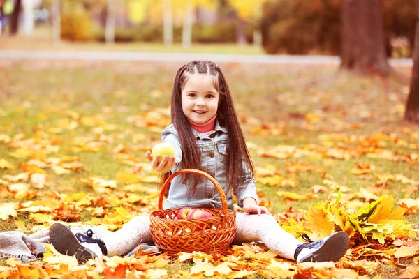 Beautiful little girl with apples — Stock Photo, Image