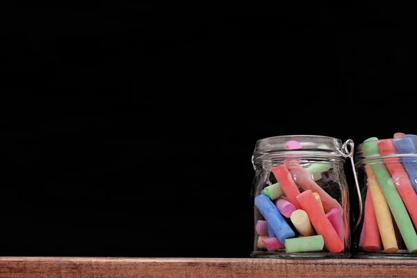 Multicoloured chalk in a jars — Stock Photo, Image