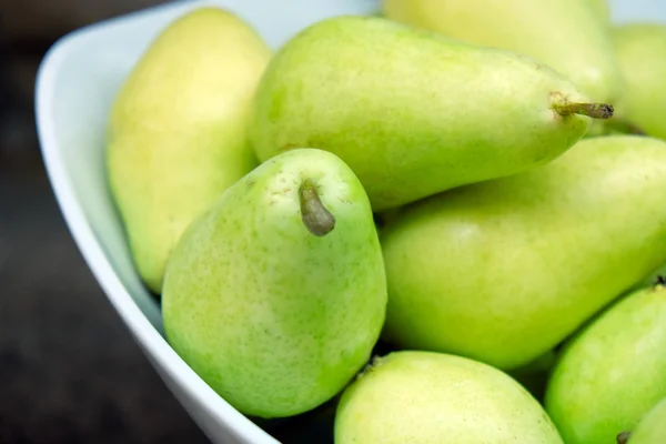 Achtergrond van rijpe sappige peren, close-up — Stockfoto