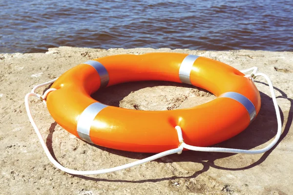 Orange life buoy — Stock Photo, Image