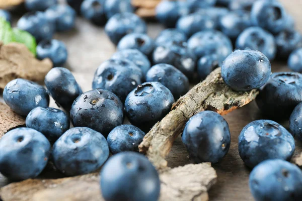 Tasty ripe blueberries on wooden table close up — Stock Photo, Image