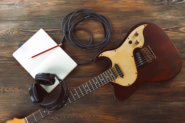 Electric guitar with headphones — Stock Photo, Image