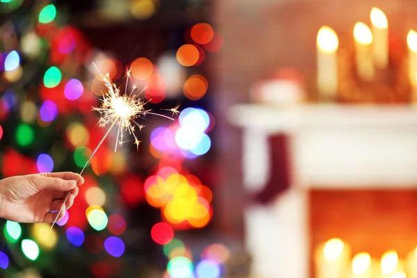 Female hand holding beautiful sparkler — Stock Photo, Image