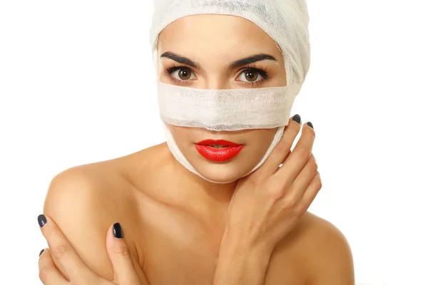 Woman with a gauze bandage on her head and nose — Stock Photo, Image