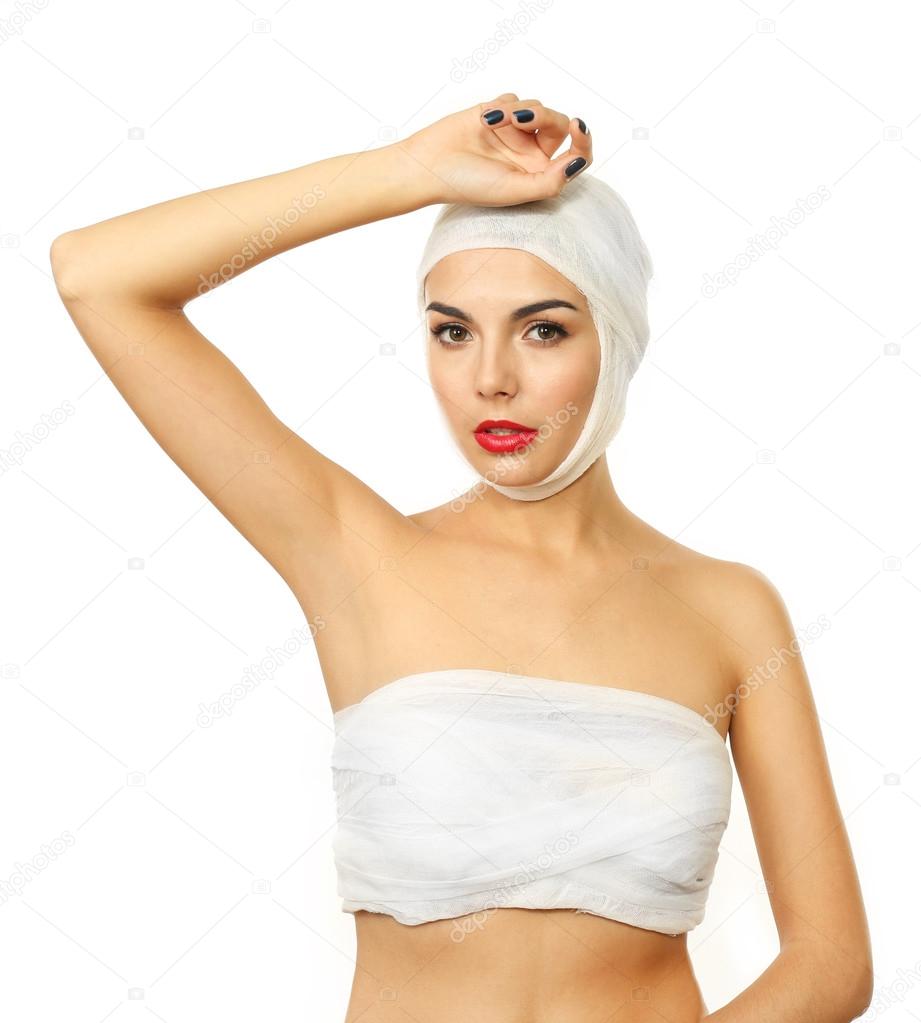 woman with bandage on her head and chest