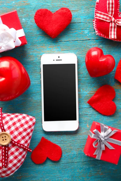 Phone with blank screen and hearts — Stock Photo, Image