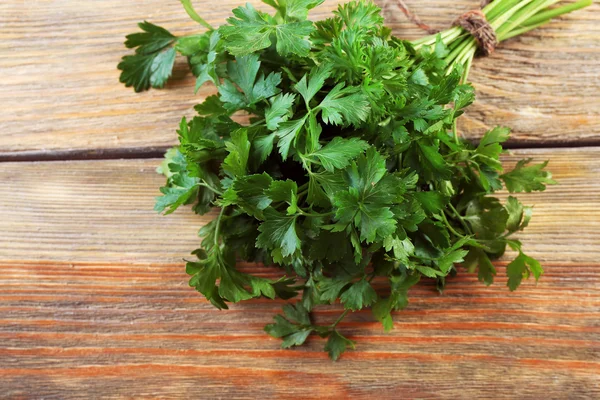 Fresh parsley on wooden background — Stock Photo, Image