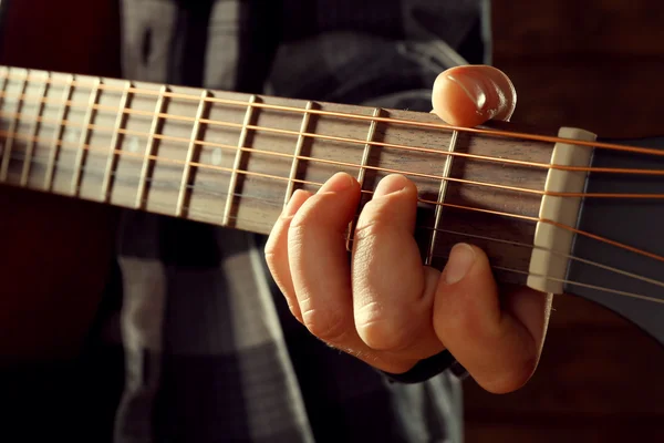 Close up view on playing guitar — Stock Photo, Image