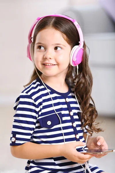 Little girl in striped dress — Stock Photo, Image