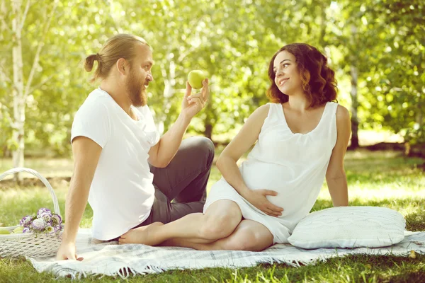 Happy couple on white blanket — Stock Photo, Image