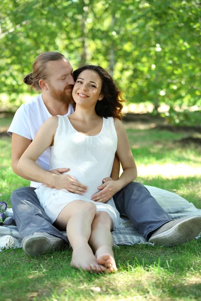 Happy Couple Embrace Sitting White Blanket Park — Stock Photo, Image