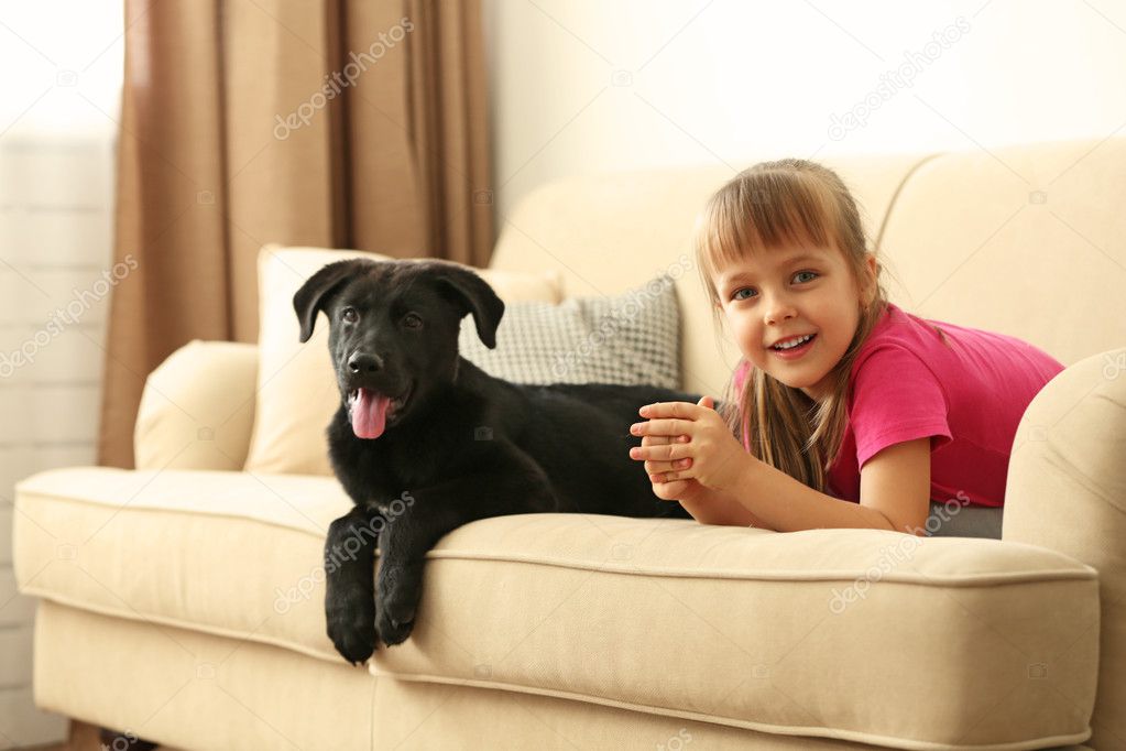 Little cute girl with puppy