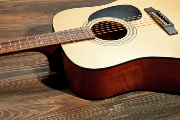 Guitar on wooden background — Stock Photo, Image