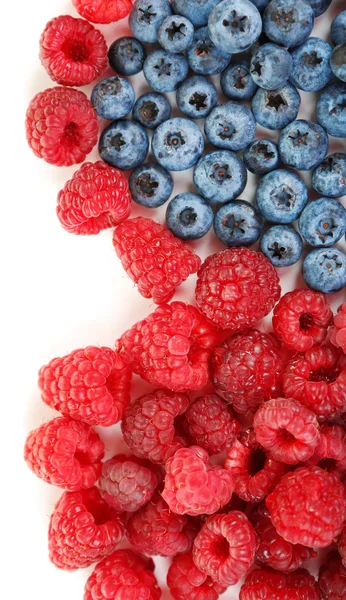 Heart shaped raspberries and blueberries closeup — Stockfoto