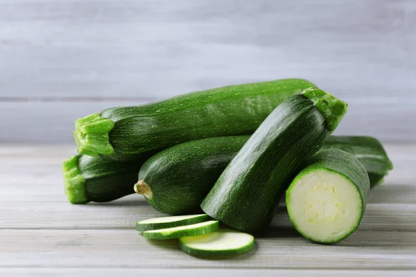 Fresh zucchini on wooden background — Stock Photo, Image