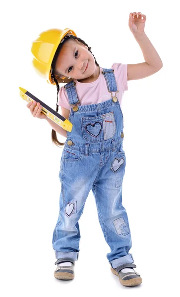 Милая маленькая девочка в желтом шлеме — стоковое фото
