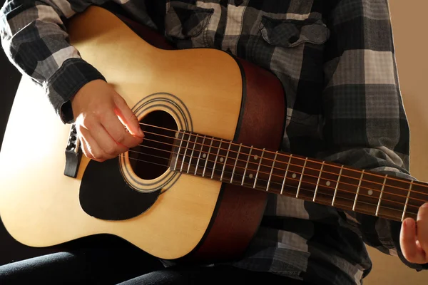 Close up view on playing guitars