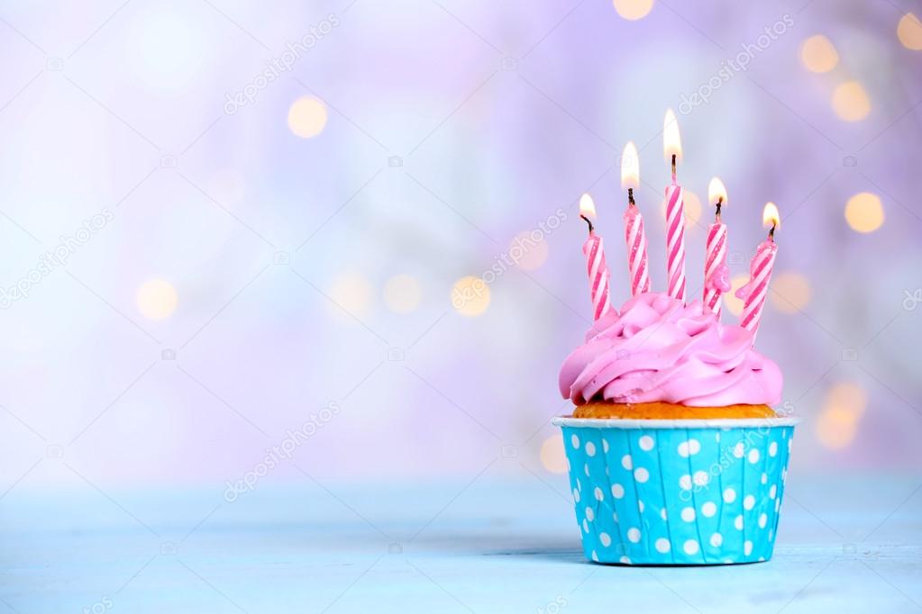 Sweet tasty cupcake with candles
