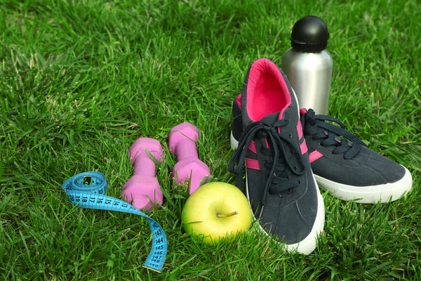 Sports equipment on grass — Stock Photo, Image