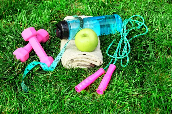 Sports equipment on grass — Stock Photo, Image