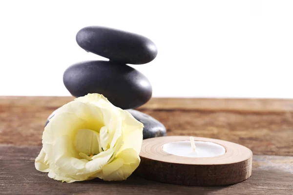 Spa stones, a candle and a rose — Stock Photo, Image
