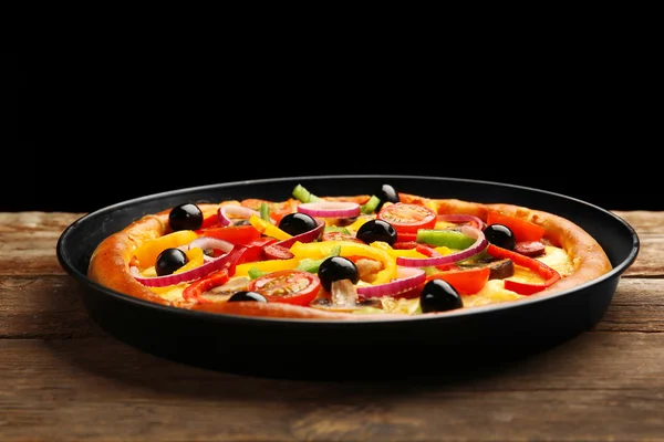 Delicious pizza with vegetables, on wooden table — Stock Photo, Image
