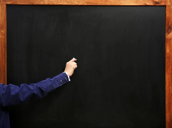 Hand schrijven op het bord schoon — Stockfoto