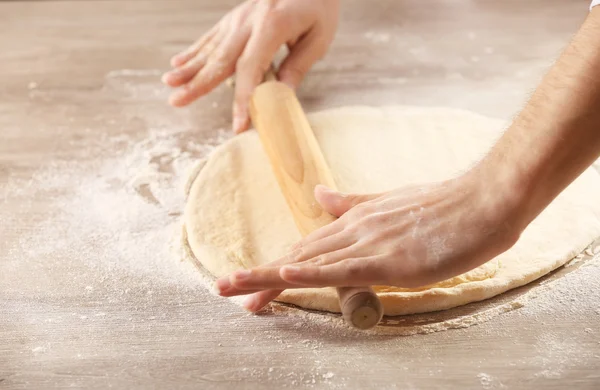 Hands rolling dough for pizza — Stock Photo, Image