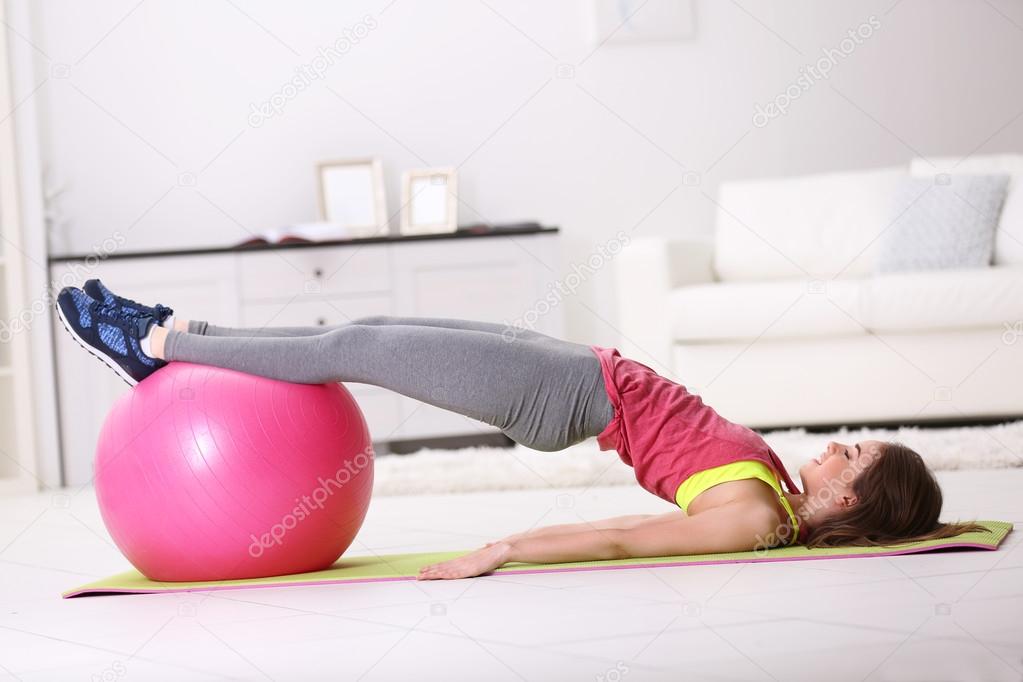 girl doing exercises with fit ball