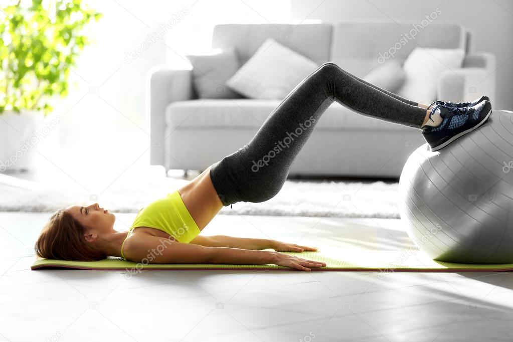 girl doing exercises with fit ball