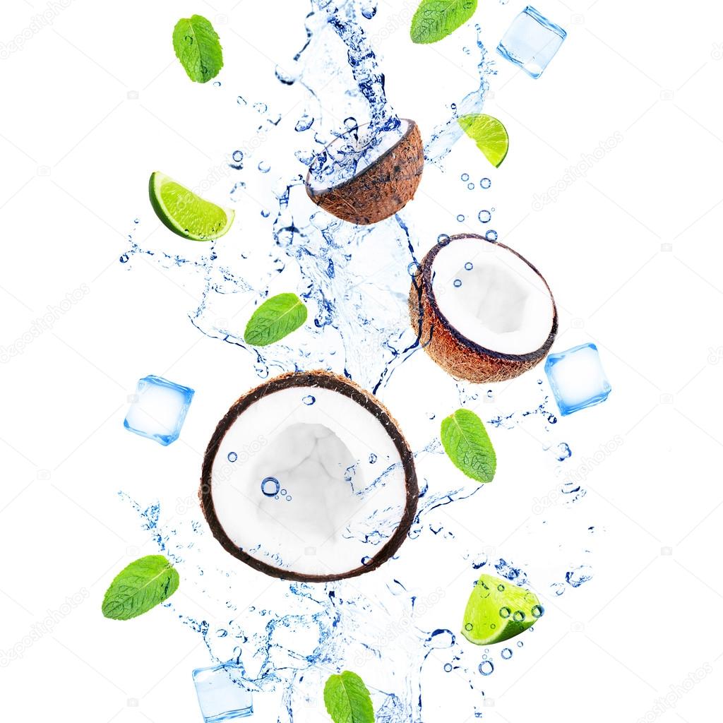 Coconuts, slices of limes with mint leaves