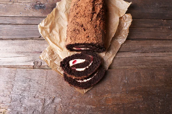 Chocolate roll with cream and berries — Stock Photo, Image