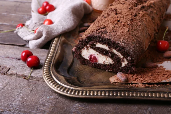 Chocolate roll with cream and berries — Stock Photo, Image