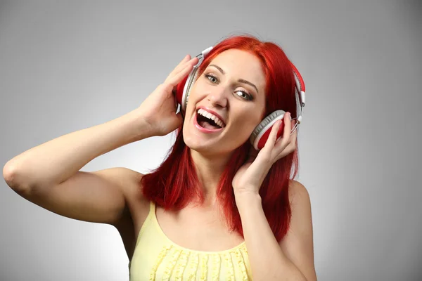 Beautiful young woman with headphones — Stock Photo, Image