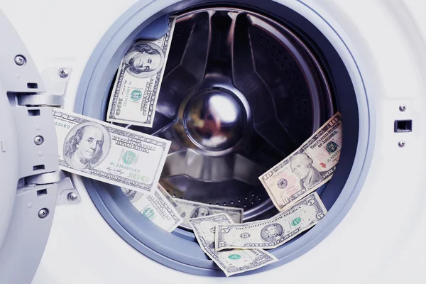 Geld in de wasmachine — Stockfoto